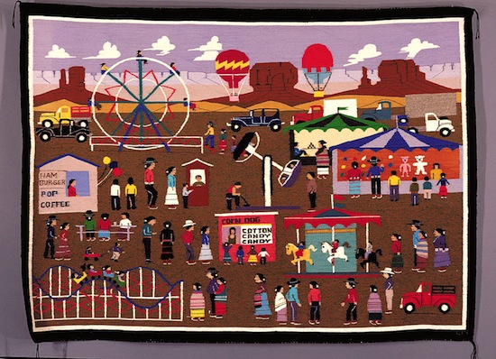 Yarn art piece featuring a carnival scene including kids, ferris wheel, hot air balloon, merry-go-round, rollercoaster, and circus tent
