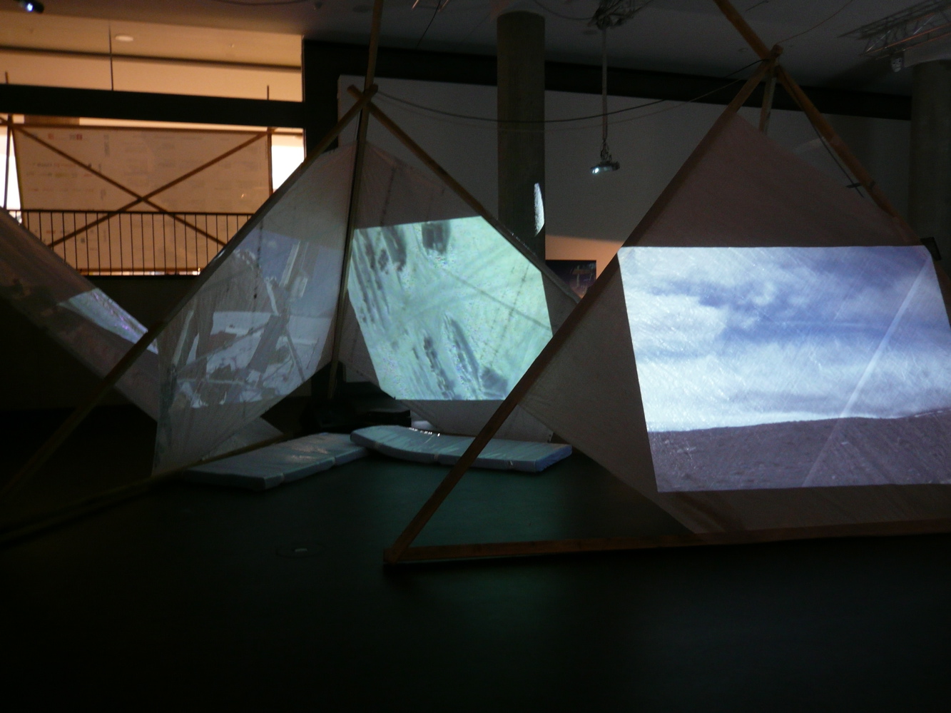 Screens of snow and tundra in Antarctica shown in a room. 