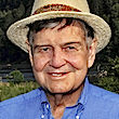Headshot of Joe Wilson wearing a straw hat.