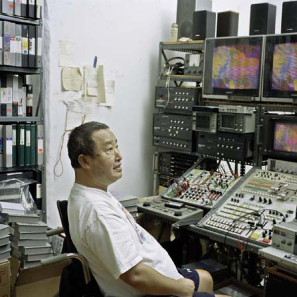 Nam June Paik in his video-editing studio in his home on Mercer Street, New York, 1999. Photo by David Heald
