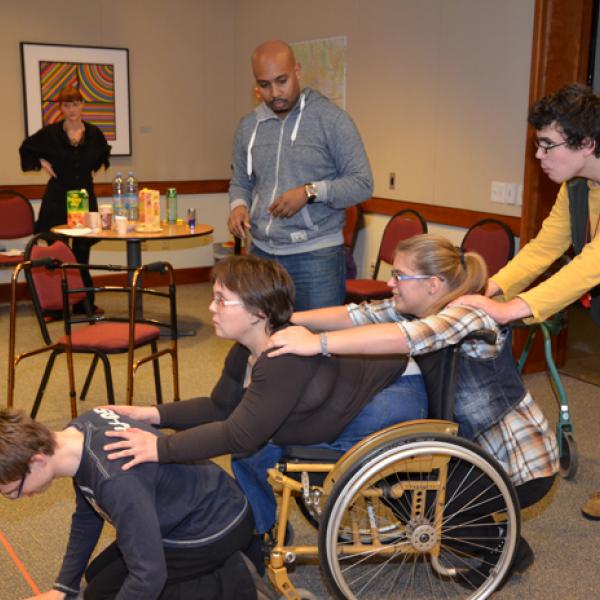Group of disabled Croatian young adults practicing a play. 