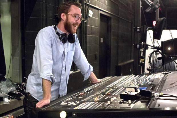 Sound engineer at a large sound board