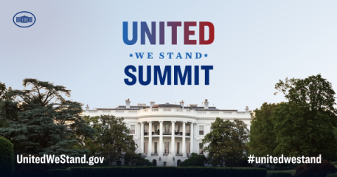 A distant photo of the White House with the words United We Stand Summit written above it.