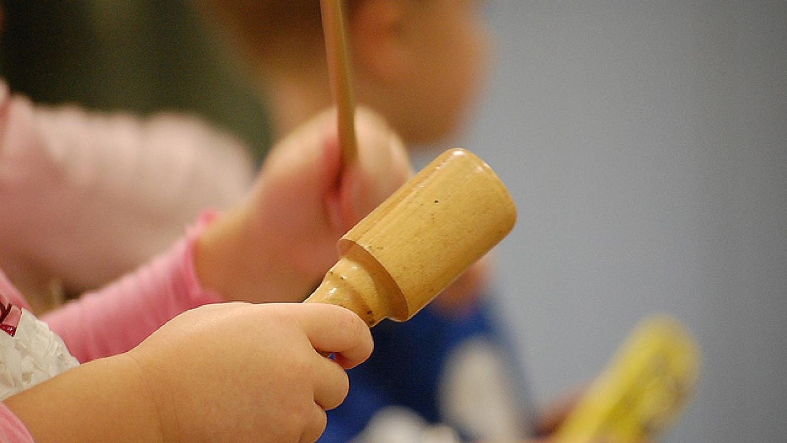 Children's hands playing instruments