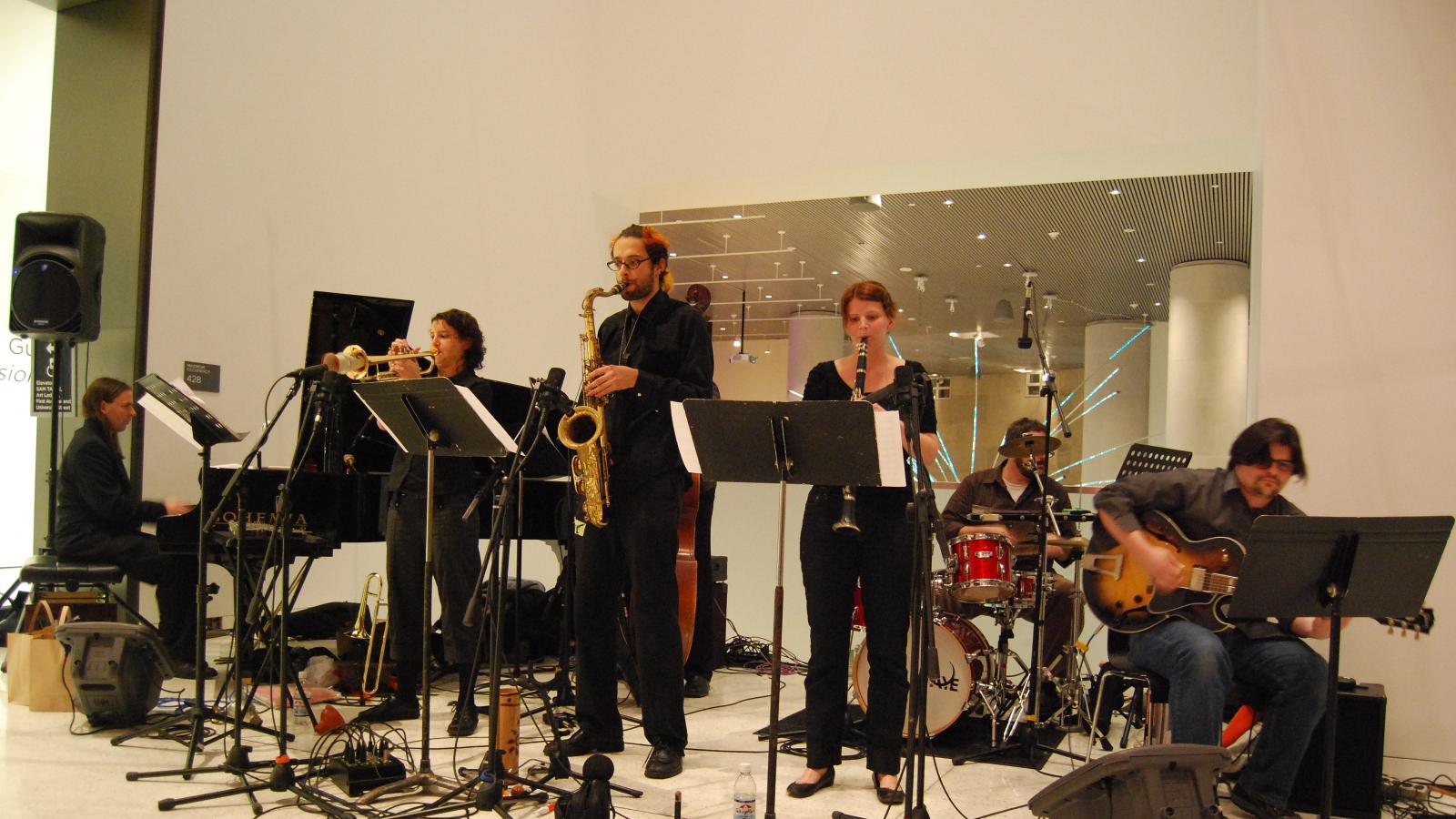A band playing at a museum. 