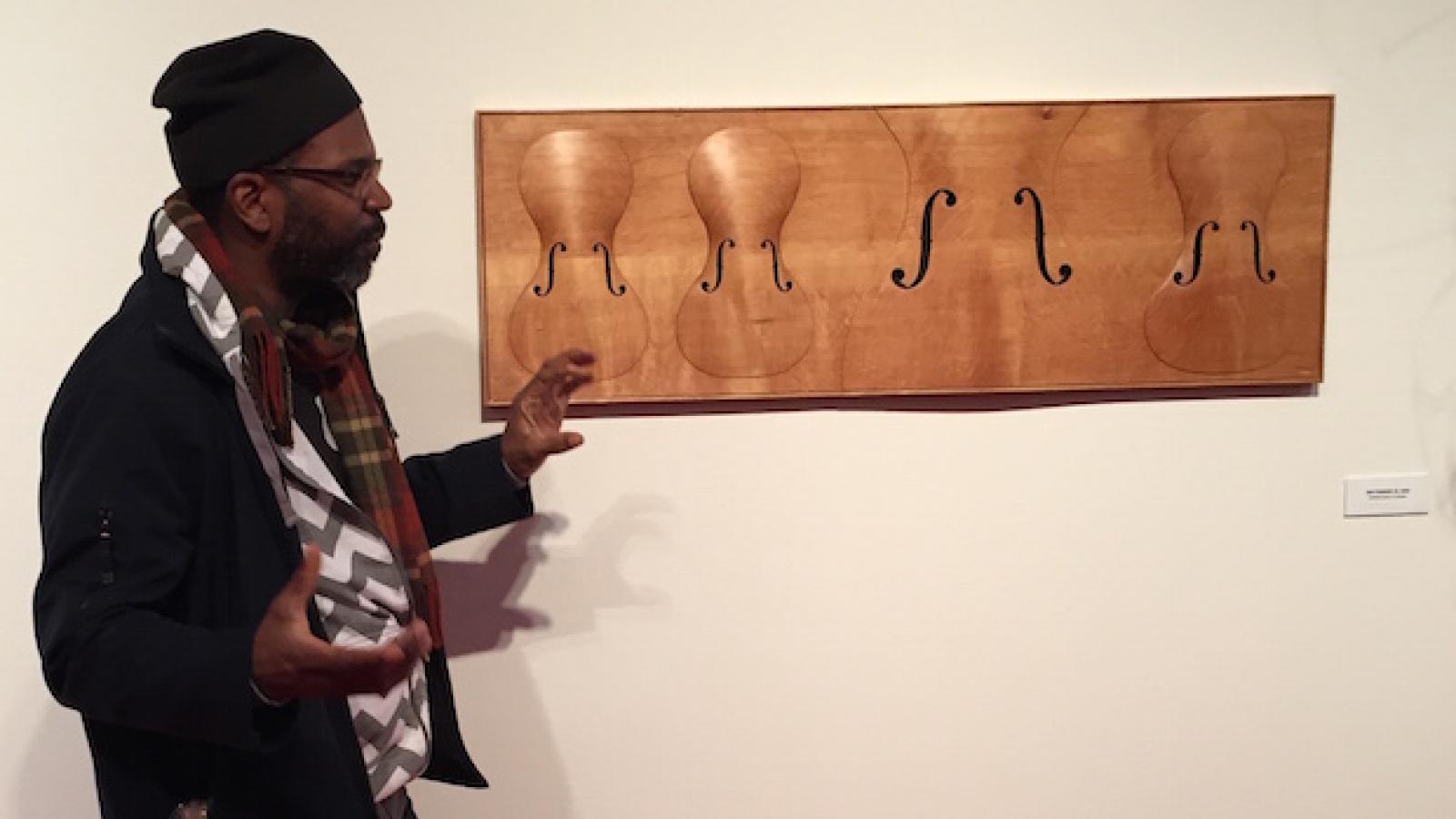 paul_rucker_explains_wood_carvings_during_art_studio_tour