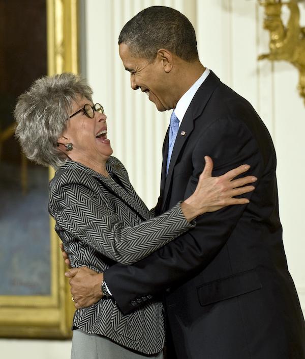 2009 National Medal of Arts recipient and singer/dancer/actress Rita Moreno receives her medal from President Barack Obama