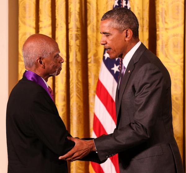 Mr. Shirley recuves hiis medal from President Obama.