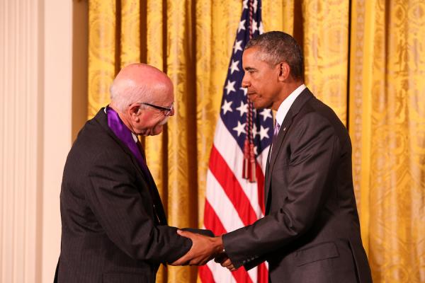 Mr. Wolff receives his medal from President Obama.