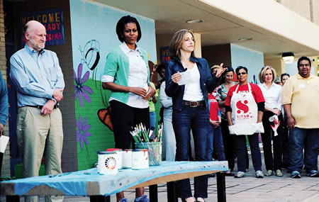 Rocco Landesman, Michelle Obama, Sitar staff and students with some of the murals behind them