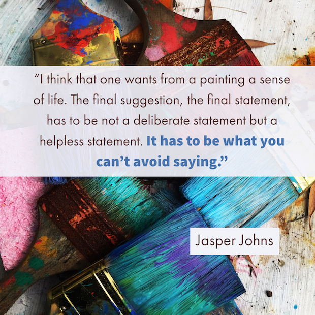 Jasper Johns quotes laid over photo of large paintbrushes covered with multicolored paint