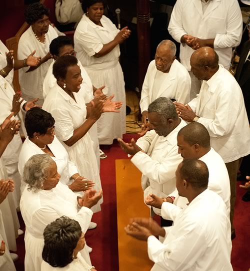 Members of Singing and Praying Bands singing in church