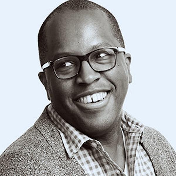 Headshot of a man smiling.