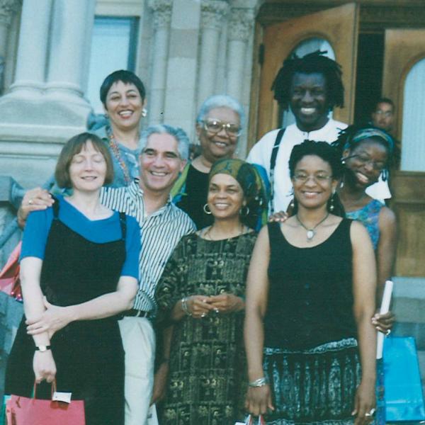 Group of Black writers standing in front of a building. 