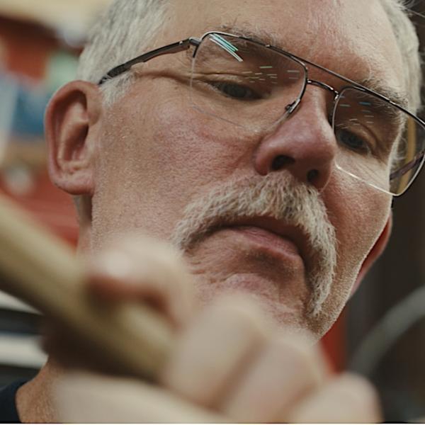 Close up of Todd Goings with woodworking tool