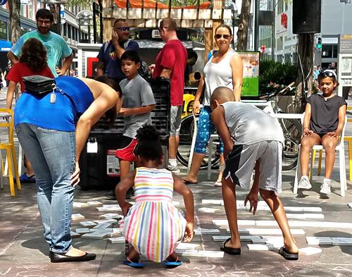 Children creating sidewalk poems