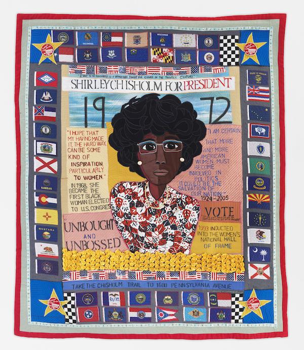 A quilt showing the face of a woman.