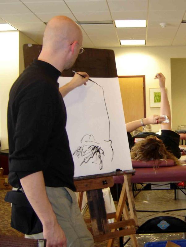 photo of Peter Buotte life painting as a person donates blood