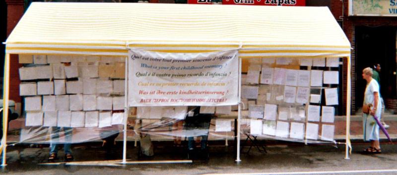 photo of a pavilion filled with handwritten notes of people recounting their first memories