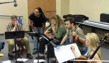 Michael Begay (second from left) working with the ETHEL String Quartet as part of the NACAP activities to bring musical education to Native-American communities. Photo courtesy of NACAP