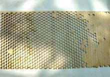 Intricate wooden honeycomb stencil