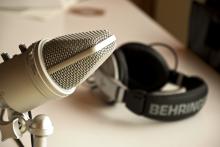 A microphone and headset in a studio.