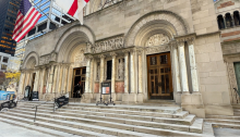 Photo of the front of the main entrance to the St. Bartholomew’s Church on Park Avenue showing carved sculptures above the doors