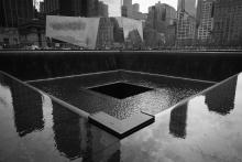 Black and white photo of the 9/11 memorial in New York City