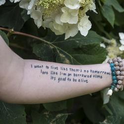 A tattooed arm belonging to a suicide survivor