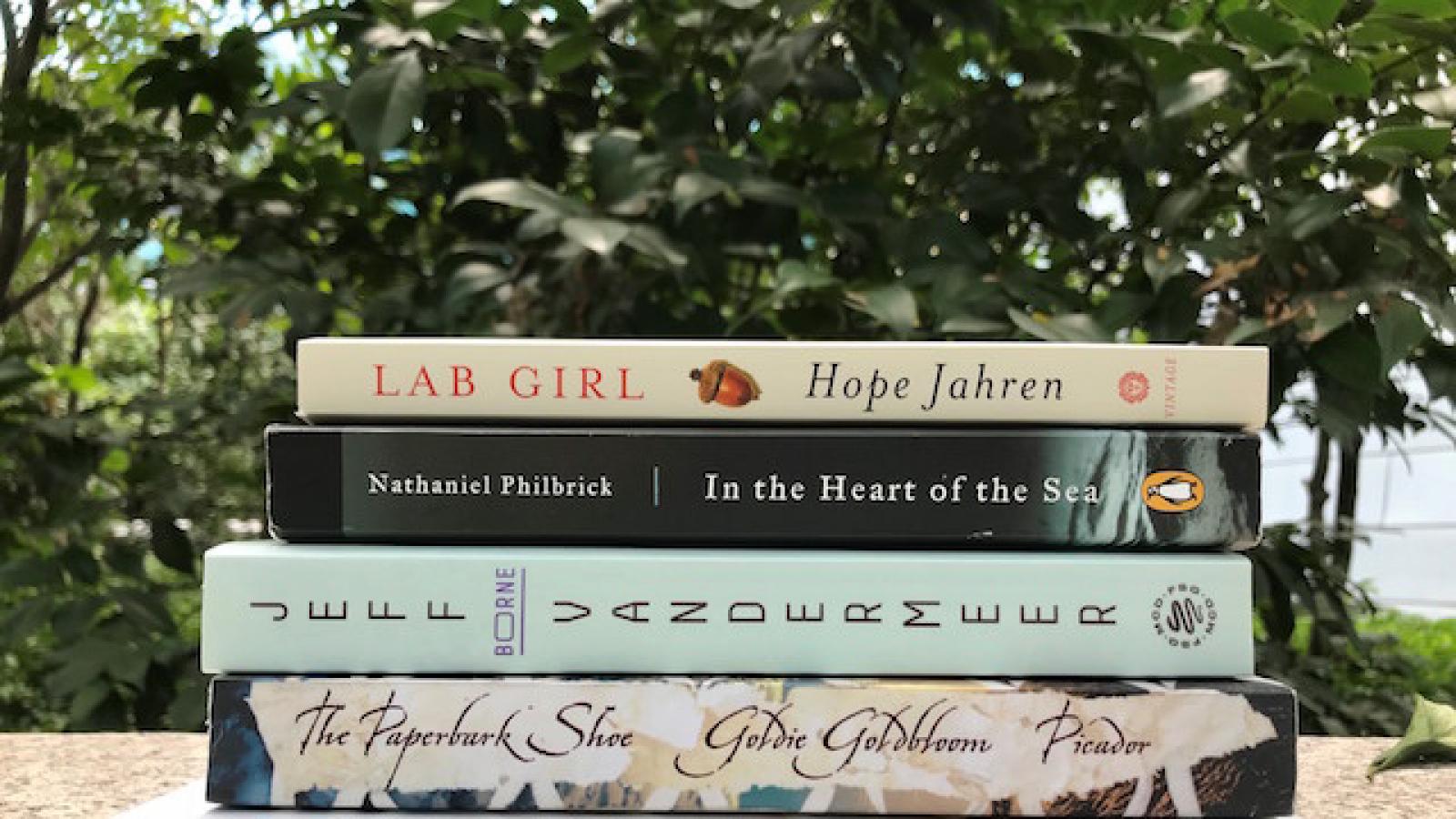 a stack of new Big Read books in a garden setting