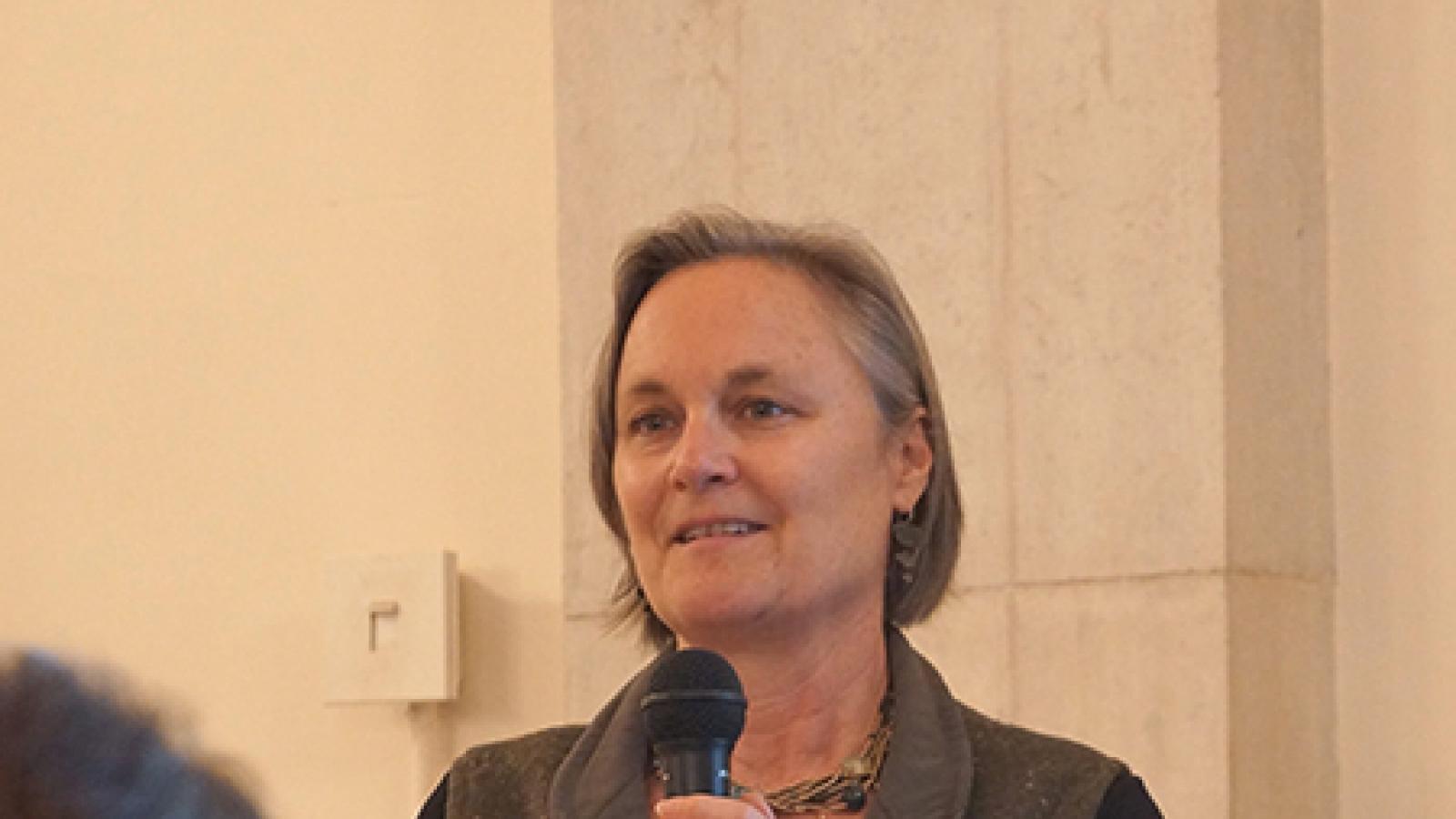 Woman at podium.