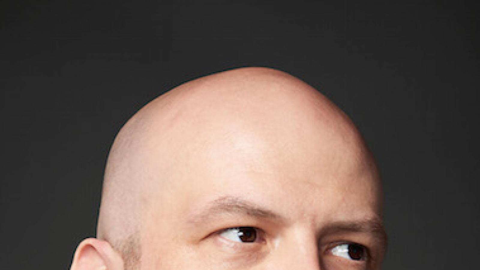 a young, bald white man