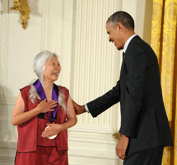 Maxine Hong Kingston receiving an award from Barack Obama