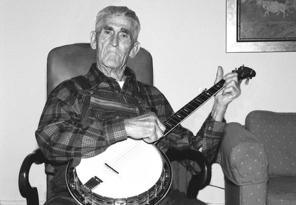 A man holding a banjo.