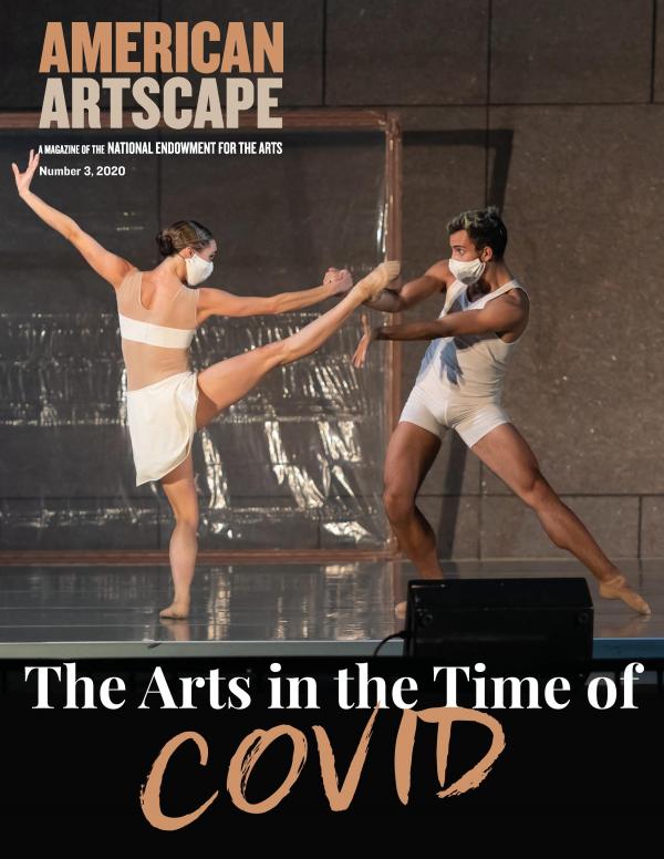 Two ballet dancers in a pas de deux wear masks as they perform onstage